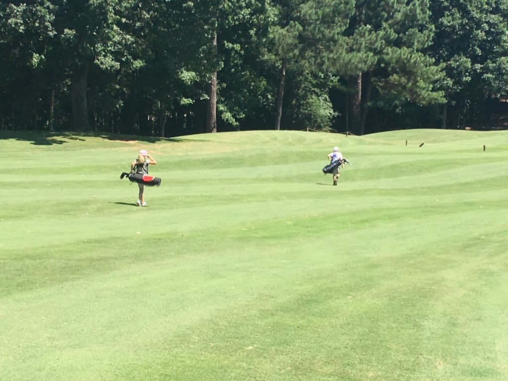 Golfers on golf course 
